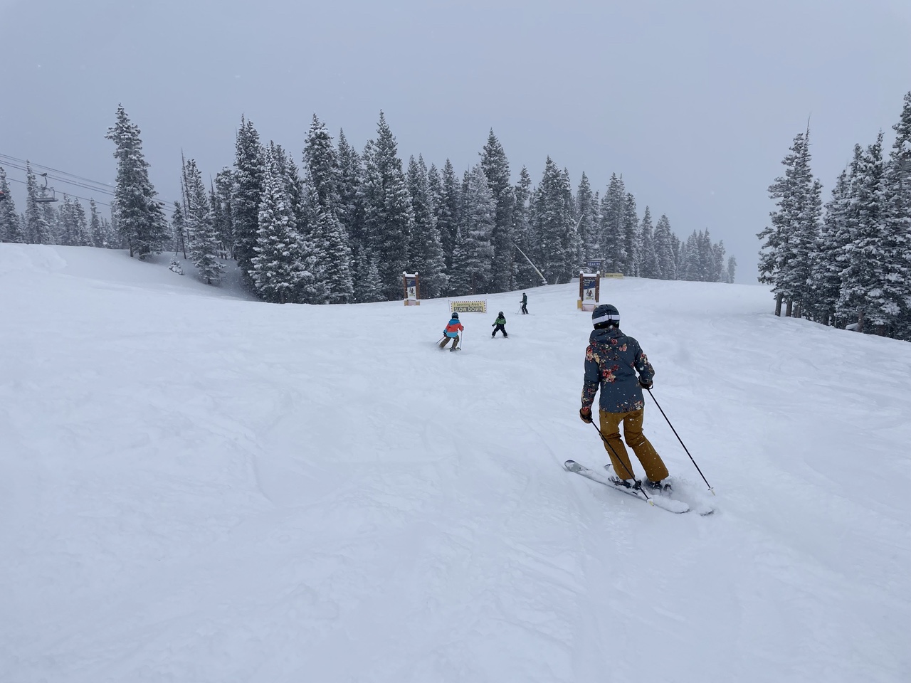 Family skiing in snow atBreckenridge Ski Resort, Colorado